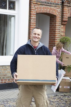 Man and van loading furniture in an Edmonton residential neighbourhood