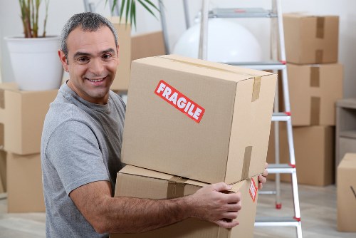 Moving crew planning a home relocation in an Edmonton neighbourhood