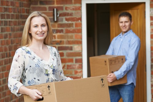 Local movers loading furniture into a moving van in Edmonton