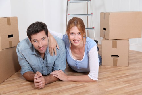 Trained mover carrying furniture with care during an Edmonton move