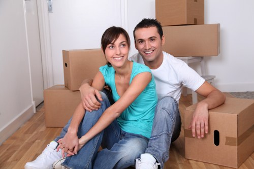 Professional movers handling boxes and household items in Edmonton