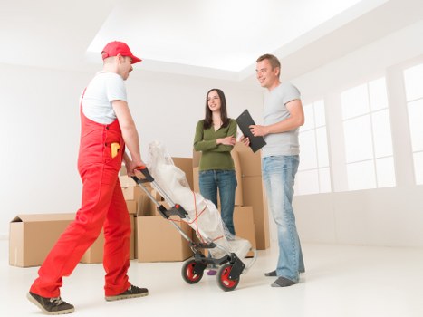 Packed moving boxes and furniture prepared for a local Edmonton move