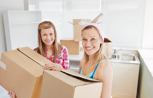 Crew moving desks and workstations during an Edmonton office relocation