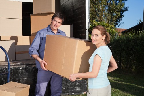 Mover wearing PPE while loading a van in Edmonton