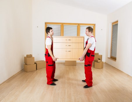 Commercial removals setup with office furniture and boxes